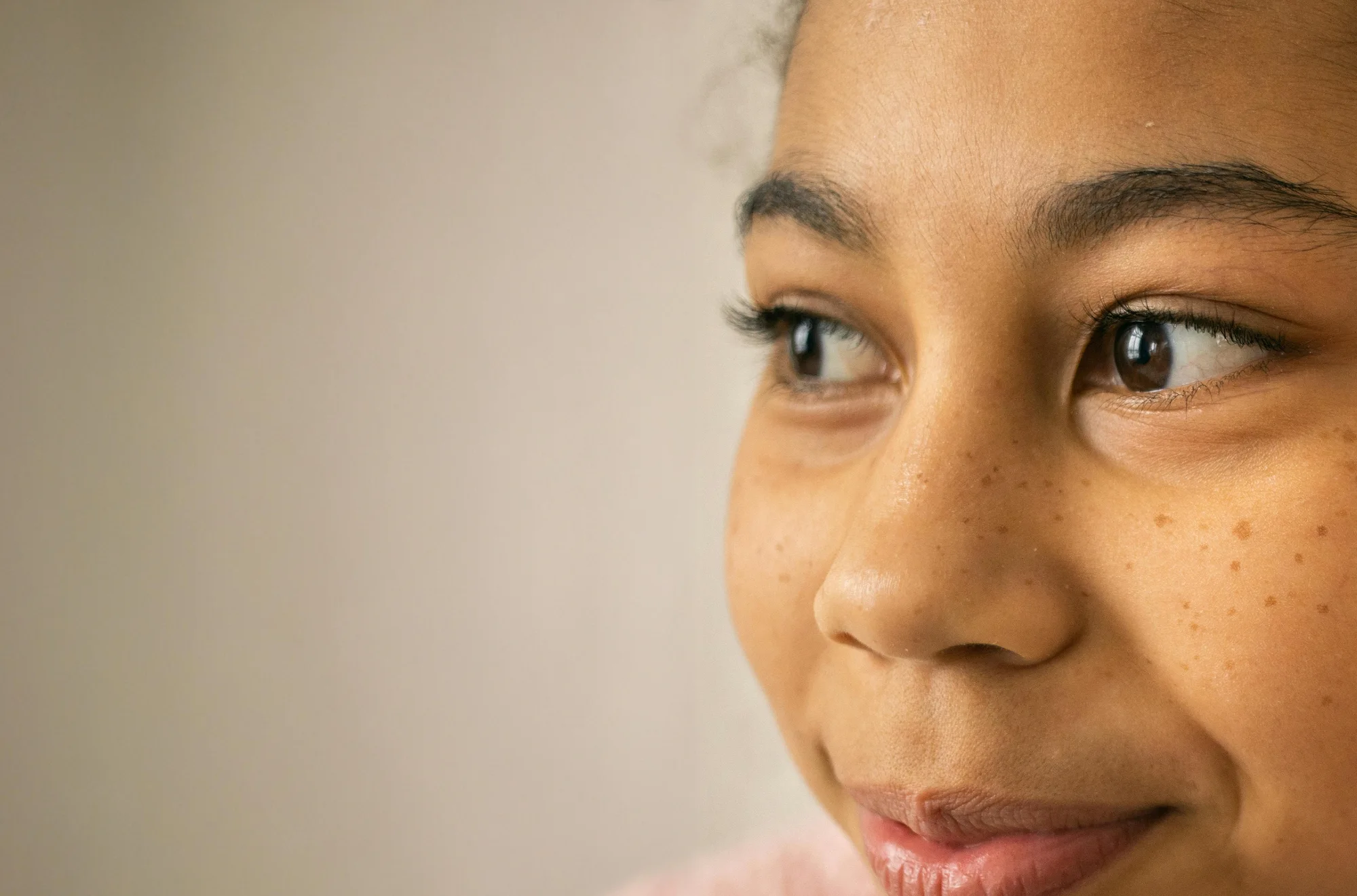 Close up portrait of a young girl with a subtle smile